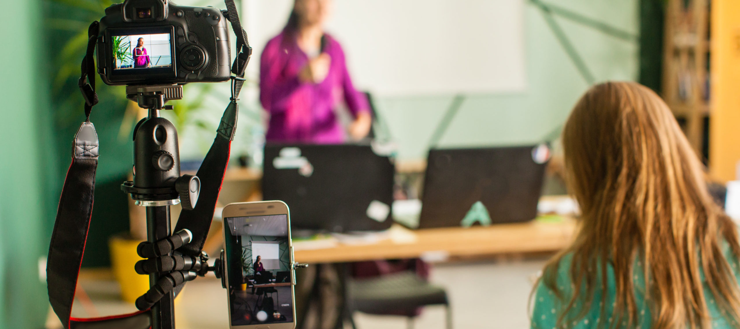 Digital events speaker in front of camera livestream